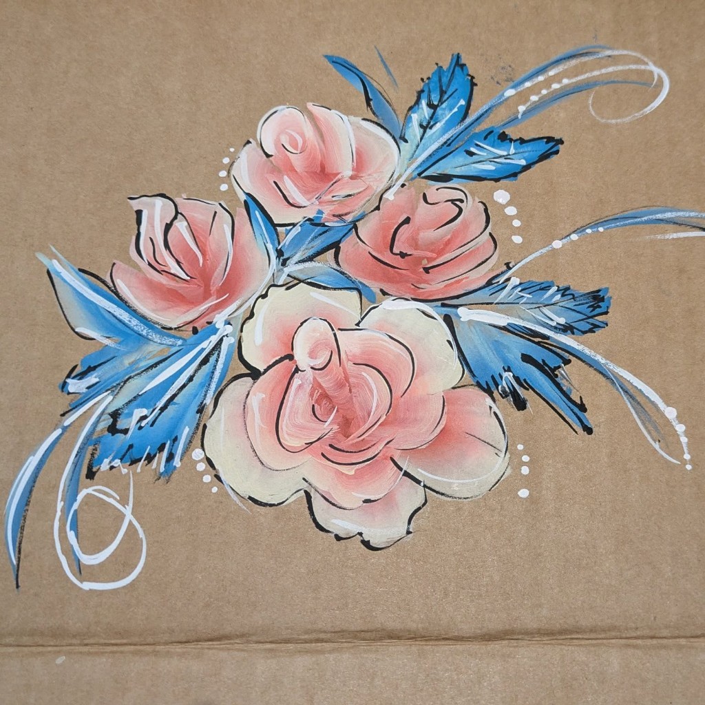 Pink roses with blue leaves painted on a practice board